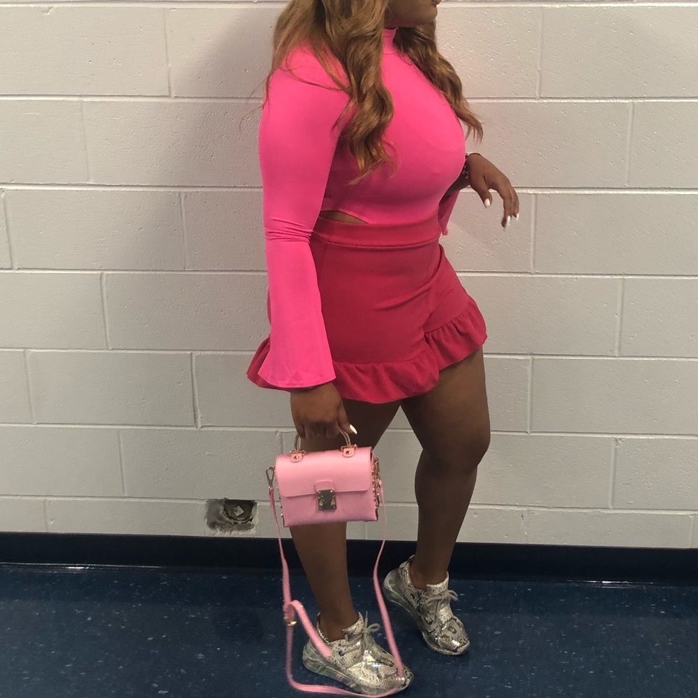 Pink shorts with ruffles.